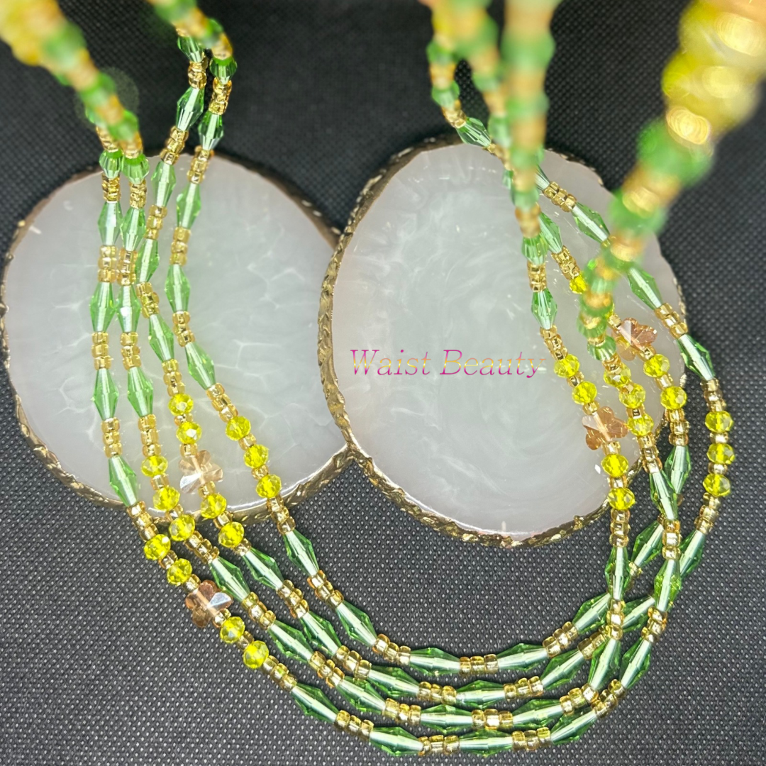 Gold, lime green, and yellow tie-on waist bead from Waist Beauty, adding a pop of vibrant color to your ensemble.
