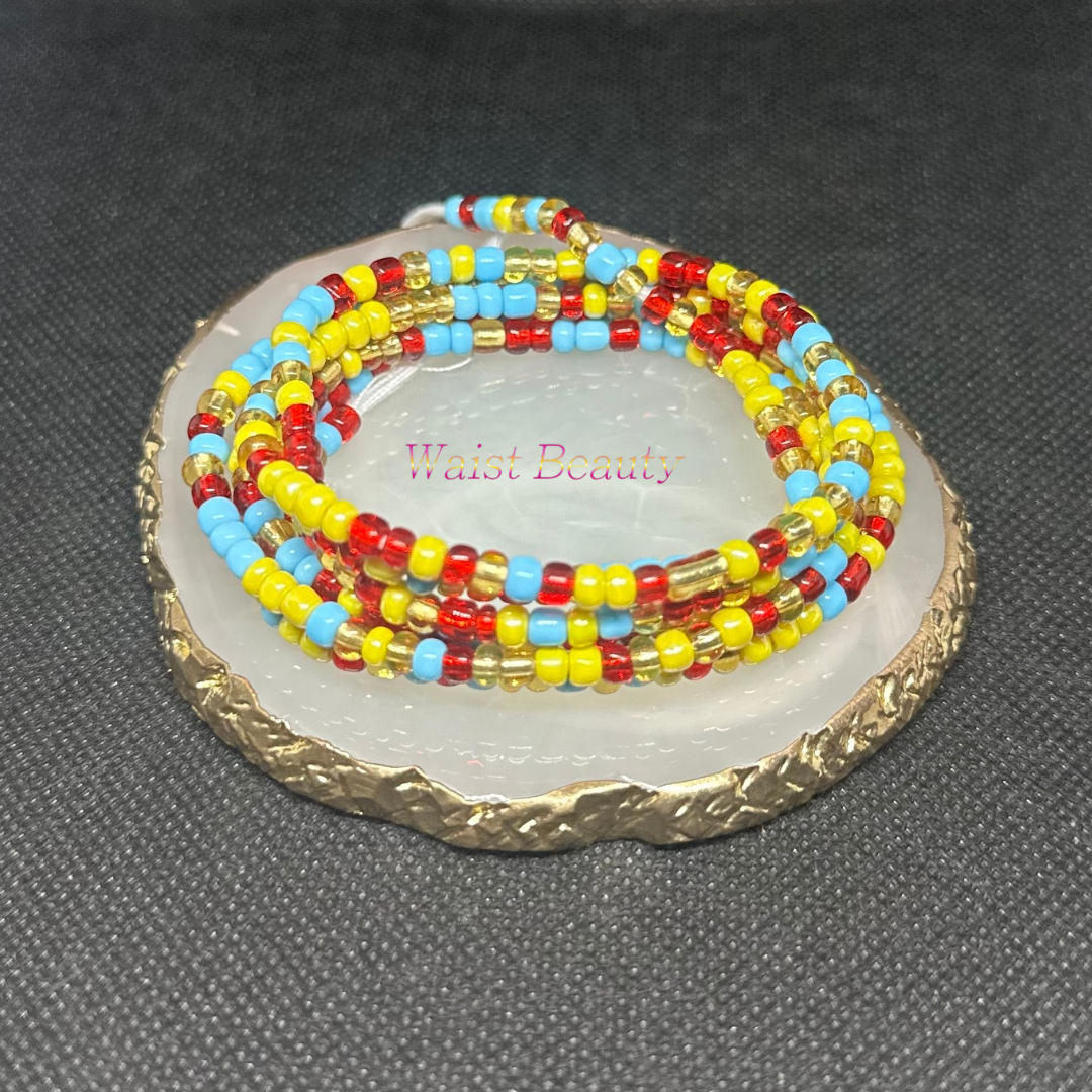 A stunning waist bead adorned with vibrant red, blue, gold, and yellow beads, adding a colorful touch to any outfit
