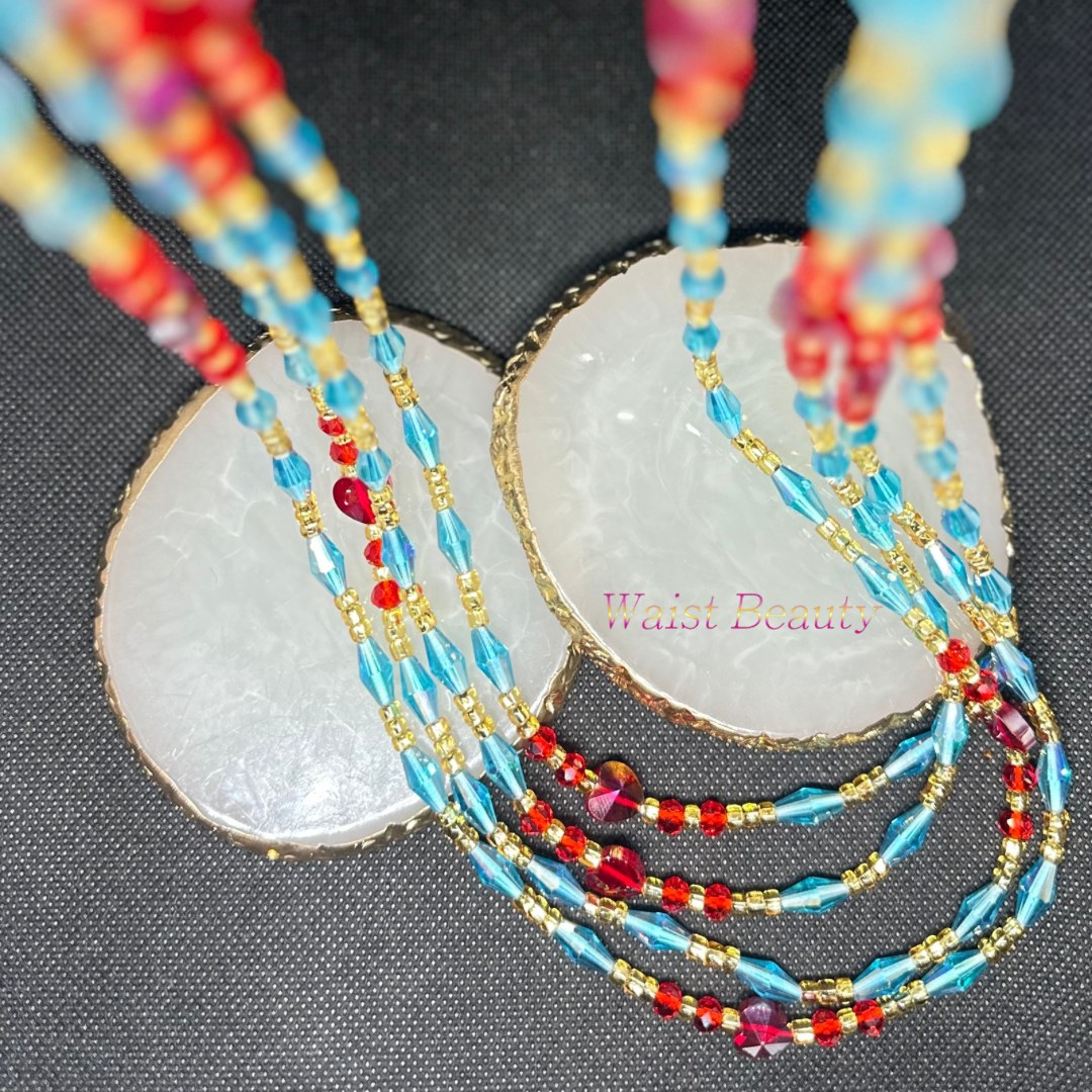 A waist bead featuring vibrant blue, red, and gold beads, creating a striking and elegant accessory.