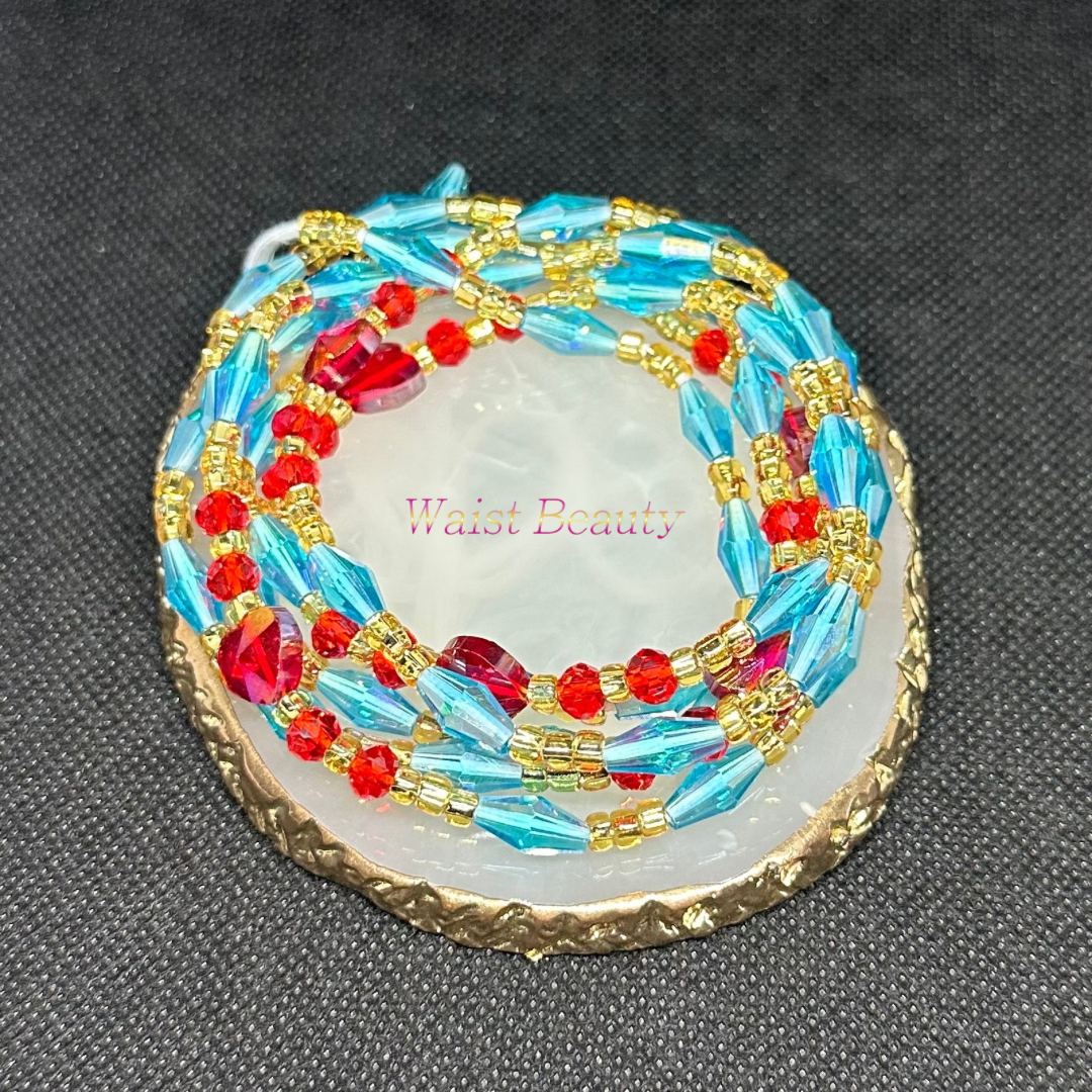 A waist bead featuring vibrant blue, red, and gold beads, creating a striking and elegant accessory.