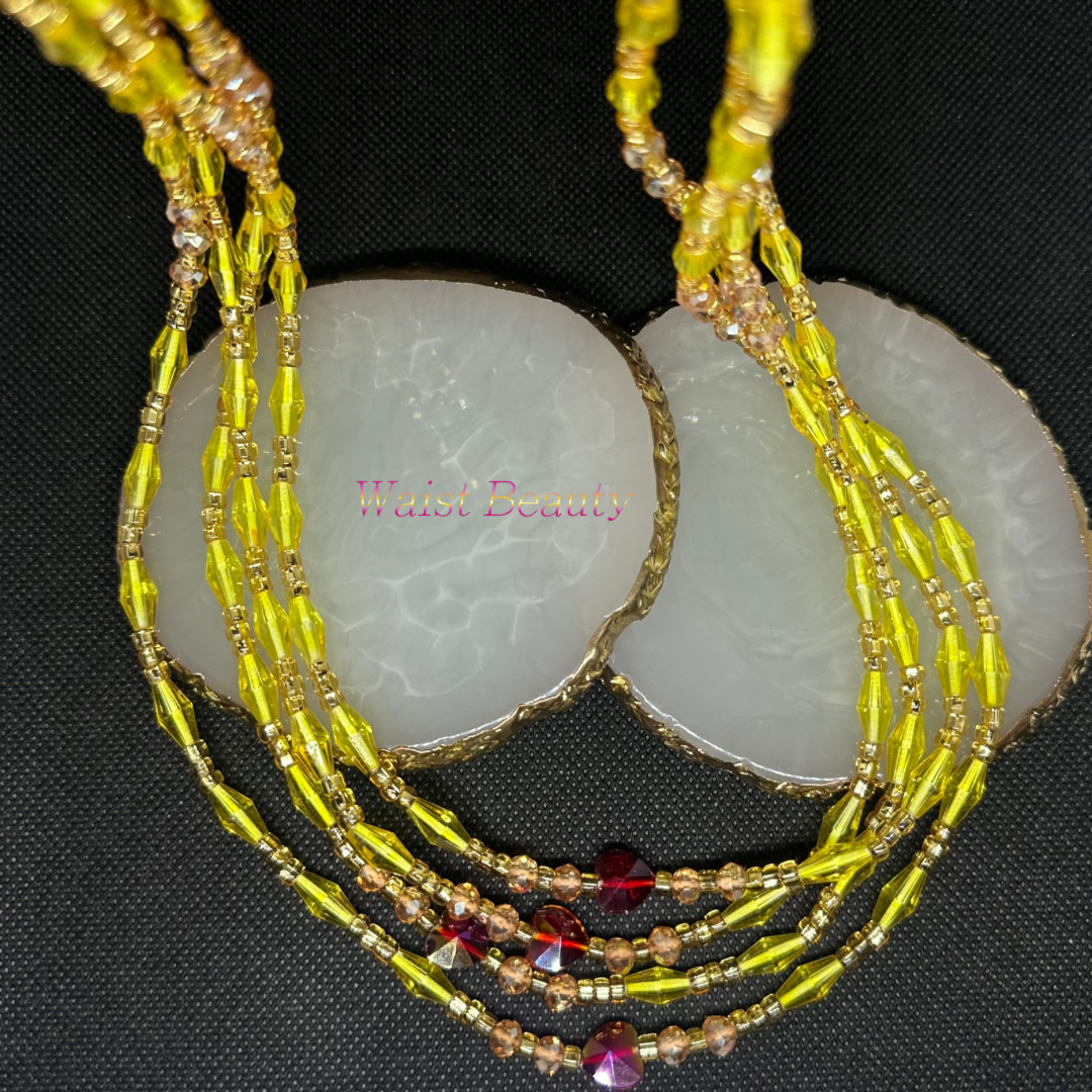 Yellow, gold, and red waist bead from Waist Beauty, radiating warmth and vibrancy with its rich hues. Handcrafted to perfection, this accessory adds a touch of elegance and style to any outfit.