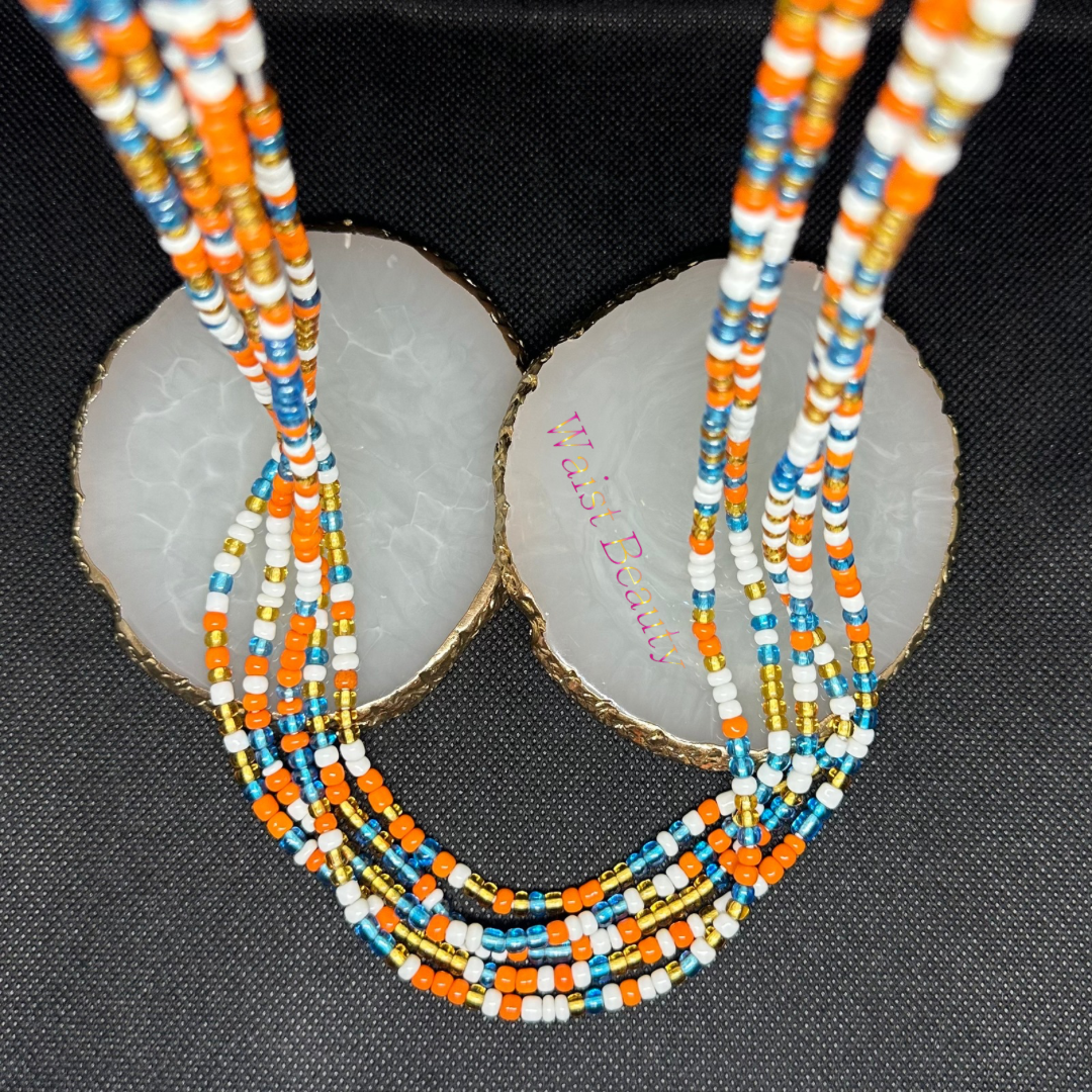 A waist bead featuring vibrant orange, blue, gold, and white beads arranged in a stylish pattern.