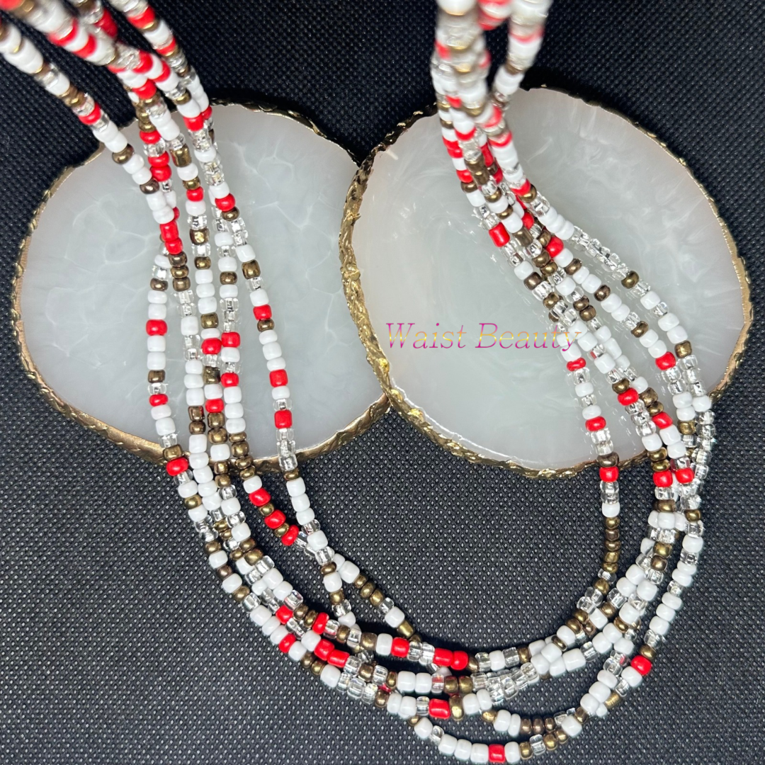 Red, white, silver, and bronze tie-on waist bead with intricate design and vibrant colors.