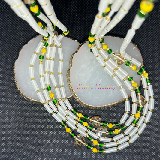 A glow-in-the-dark tie-on waist bead in vibrant yellow, green, white, and gold hues, perfect for adding a pop of color to your ensemble.