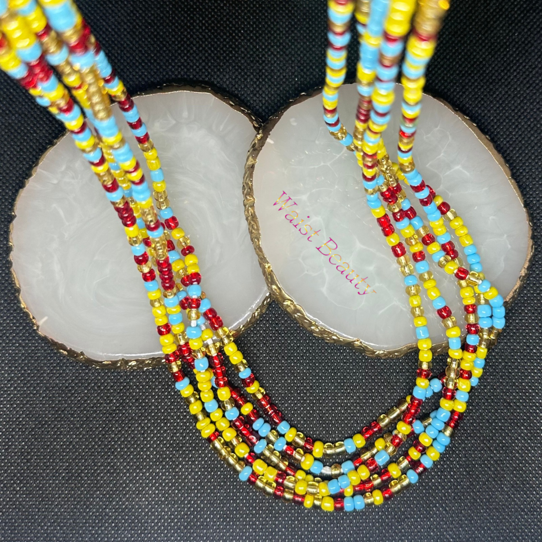 A stunning waist bead adorned with vibrant red, blue, gold, and yellow beads, adding a colorful touch to any outfit