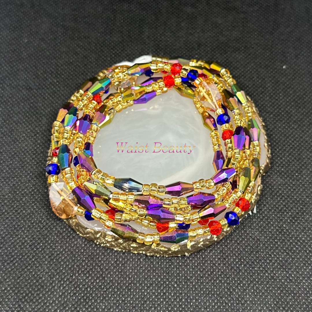 A stunning tie-on waist bead from Waist Beauty featuring a colorful combination of gold, purple, blue, and red beads.