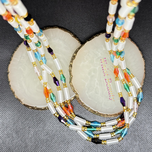 Channel the ethereal beauty of the night sky with the Aurora Borealis tie-on waist beads. Designed using frosted white tube beads as a clean, structured base, this piece is punctuated by spectacular multi-hued crystal faceted rondelles in shades of sunset orange, emerald green, sky blue, and deep amethyst. Perfectly tied together with premium metallic gold accents, this 53-inch strand serves as an empowering reminder of your unique, multi-faceted inner strength.