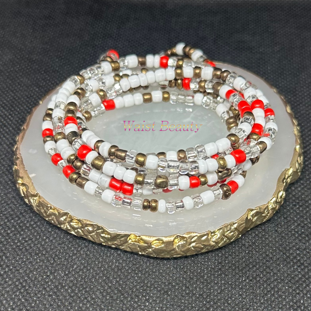 Red, white, silver, and bronze tie-on waist bead with intricate design and vibrant colors.