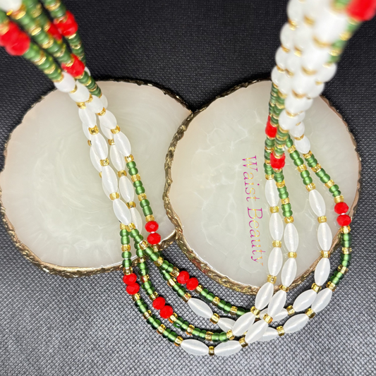 tie-on waist beads. This striking pattern showcases luminous, milky-white rice beads seamlessly contrasted with rows of earthy green seed beads and pops of bold scarlet crystal rondelles. Surrounded by rich gold spacers, this 53-inch strand represents abundance, fertility, and confidence. Tie it on permanently to embrace your natural curves and beautifully track your body's daily changes.