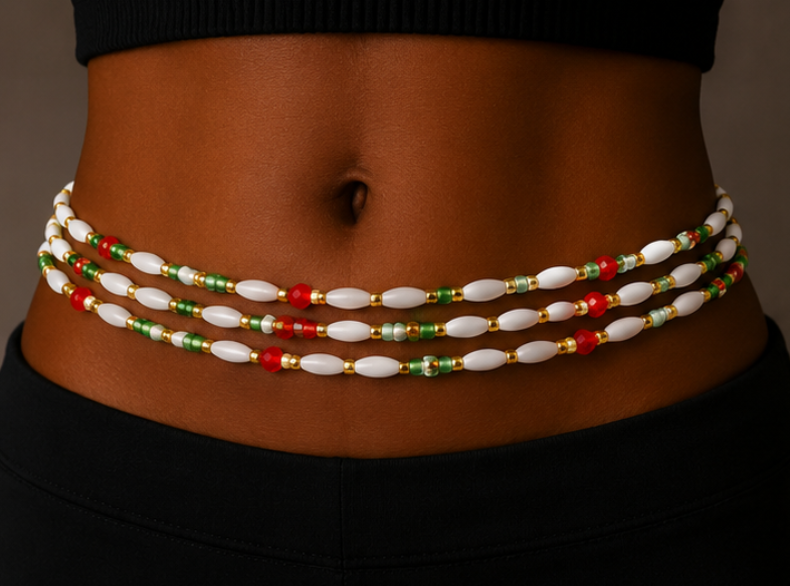 A close-up of a model's waist wearing a multi-strand beaded waist chain with white oval beads, green and red spacer beads, and gold-toned metal accents.